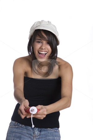 To use this stock image in your creative project, please select the size you need over to the right and click the "Add to Cart" button.
Your downloaded image will come with the Cutcaster watermark removed so don’t worry about the watermark you see on this page. Spraying ketchup stock photo, Teenage girl wearing a black tube top, knitted hat and jeans with holes squeezing a ketchup bottle by Yann Poirier