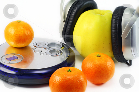 To use this stock image in your creative project, please select the size you need over to the right and click the "Add to Cart" button.
Your downloaded image will come with the Cutcaster watermark removed so don’t worry about the watermark you see on this page. Fruit listens to music stock photo, Juicy ripe tangerines and huge yellow apple listen to music through compact player. by Aleksandr Volokov