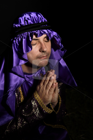 To use this stock image in your creative project, please select the size you need over to the right and click the "Add to Cart" button.
Your downloaded image will come with the Cutcaster watermark removed so don’t worry about the watermark you see on this page. Worshipping man stock photo, Man arrayed in purple and gold robe with hands together praying by Leah-Anne Thompson