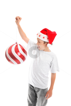 To use this stock image in your creative project, please select the size you need over to the right and click the "Add to Cart" button.
Your downloaded image will come with the Cutcaster watermark removed so don’t worry about the watermark you see on this page. Get ready for Christmas stock photo, A child enjoying the Christmas season holdss up a big bauble by Leah-Anne Thompson