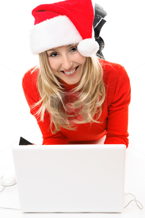 To use this stock image in your creative project, please select the size you need over to the right and click the "Add to Cart" button.
Your downloaded image will come with the Cutcaster watermark removed so don’t worry about the watermark you see on this page. Christmas girl at laptop stock photo, Christmas girl on a laptop computer, shopping for gifts, banking, etc online. by Leah-Anne Thompson