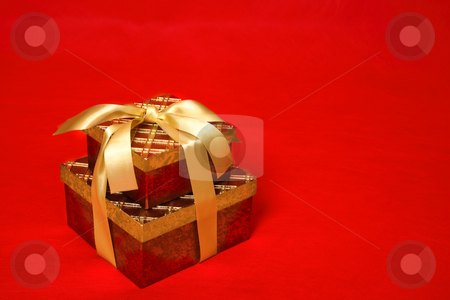 To use this stock image in your creative project, please select the size you need over to the right and click the "Add to Cart" button.
Your downloaded image will come with the Cutcaster watermark removed so don’t worry about the watermark you see on this page. Gift Boxes stock photo, Gift boxes tied up with gold satin ribbon for Christmas, a birthday or other special occasion by Leah-Anne Thompson