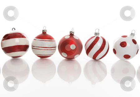 To use this stock image in your creative project, please select the size you need over to the right and click the "Add to Cart" button.
Your downloaded image will come with the Cutcaster watermark removed so don’t worry about the watermark you see on this page. Five Festive Christmas Baubles stock photo, Red and white Christmas baubles with various designs on a white background. by Leah-Anne Thompson