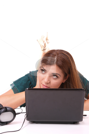 To use this stock image in your creative project, please select the size you need over to the right and click the "Add to Cart" button.
Your downloaded image will come with the Cutcaster watermark removed so don’t worry about the watermark you see on this page. Listening to Music stock photo, Beautiful young woman with headphones and laptop Listening to Music by Remy Musser