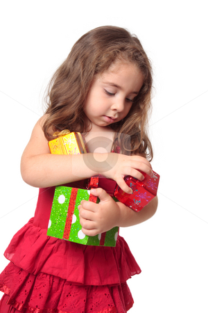 To use this stock image in your creative project, please select the size you need over to the right and click the "Add to Cart" button.
Your downloaded image will come with the Cutcaster watermark removed so don’t worry about the watermark you see on this page. Girl holding an armful of Christmas presents stock photo, Little girl holding some Christmas presents in her arms. by Leah-Anne Thompson