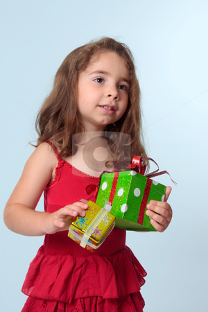 To use this stock image in your creative project, please select the size you need over to the right and click the "Add to Cart" button.
Your downloaded image will come with the Cutcaster watermark removed so don’t worry about the watermark you see on this page. Little girl holding Christmas presents stock photo, Young preschool girl holding presents. She is wearing a red dress. by Leah-Anne Thompson