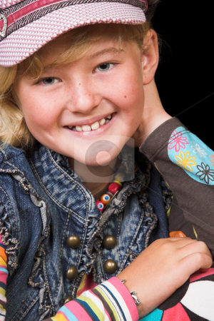 To use this stock image in your creative project, please select the size you need over to the right and click the "Add to Cart" button.
Your downloaded image will come with the Cutcaster watermark removed so don’t worry about the watermark you see on this page. Young Girl stock photo, Young girl wearing a hat, against a black background by Carla Booysen
