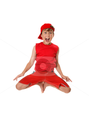 To use this stock image in your creative project, please select the size you need over to the right and click the "Add to Cart" button.
Your downloaded image will come with the Cutcaster watermark removed so don’t worry about the watermark you see on this page. Excited boy jumping off the ground. stock photo, Thrilled boy jumps off the ground with feet in tight to his body. by Leah-Anne Thompson