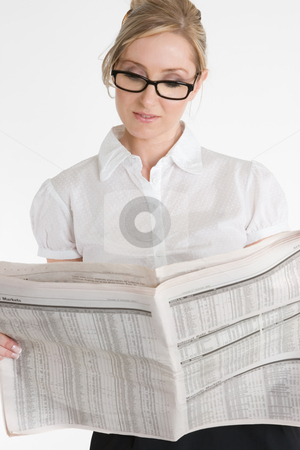 To use this stock image in your creative project, please select the size you need over to the right and click the "Add to Cart" button.
Your downloaded image will come with the Cutcaster watermark removed so don’t worry about the watermark you see on this page. Businesswoman reading financial newspaper stock photo, A businesswoman reading the financial newspaper. Please note newsprint has been artificially blurred to render company names illegible. by Leah-Anne Thompson