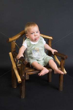 To use this stock image in your creative project, please select the size you need over to the right and click the "Add to Cart" button.
Your downloaded image will come with the Cutcaster watermark removed so don’t worry about the watermark you see on this page. Baby stock photo, Baby Boy wearing a pastel dungaree and white shirt by Carla Booysen