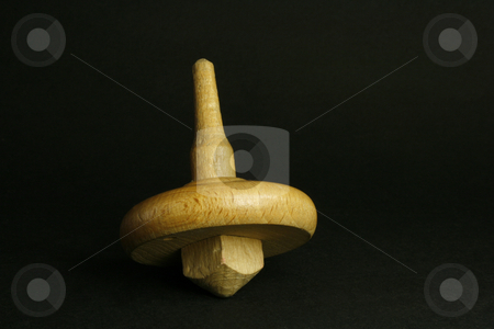 To use this stock image in your creative project, please select the size you need over to the right and click the "Add to Cart" button.
Your downloaded image will come with the Cutcaster watermark removed so don’t worry about the watermark you see on this page. Spinning top stock photo, Close up of a spinning top tpy on a black background by Marina Magri