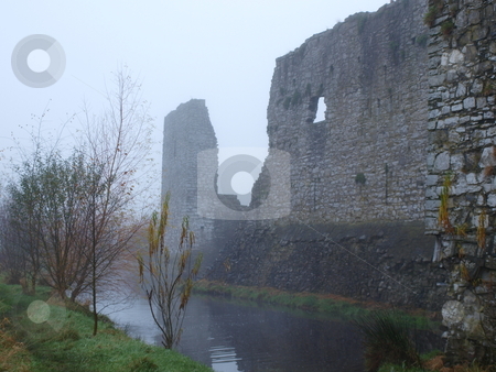 To use this stock image in your creative project, please select the size you need over to the right and click the "Add to Cart" button.
Your downloaded image will come with the Cutcaster watermark removed so don’t worry about the watermark you see on this page. Castle Ruins stock photo, Trim Castle at the shores of the river Boyne in Ireland. by Stefanie Michel