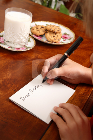 To use this stock image in your creative project, please select the size you need over to the right and click the "Add to Cart" button.
Your downloaded image will come with the Cutcaster watermark removed so don’t worry about the watermark you see on this page. Christmas Eve stock photo, A child writing a letter to Santa by Leah-Anne Thompson