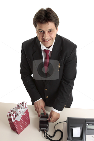 To use this stock image in your creative project, please select the size you need over to the right and click the "Add to Cart" button.
Your downloaded image will come with the Cutcaster watermark removed so don’t worry about the watermark you see on this page. Man buys Christmas present credit card stock photo, A man dressed in suit buying a birthday, Christmas or special occasion present using credit or debit card. by Leah-Anne Thompson