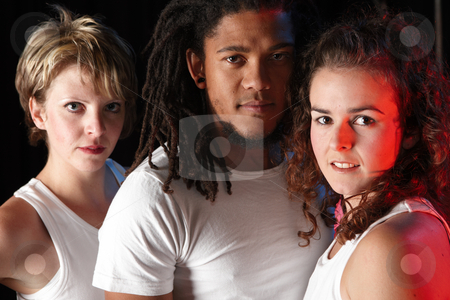 To use this stock image in your creative project, please select the size you need over to the right and click the "Add to Cart" button.
Your downloaded image will come with the Cutcaster watermark removed so don’t worry about the watermark you see on this page. Dancers on stage stock photo, A group of two female and one male freestyle hip-hop dancers in a dancing training session. Lit with spotlights by Sean Nel