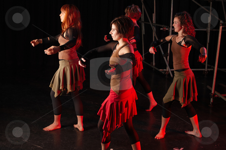 To use this stock image in your creative project, please select the size you need over to the right and click the "Add to Cart" button.
Your downloaded image will come with the Cutcaster watermark removed so don’t worry about the watermark you see on this page. Dancers on stage stock photo, A group of four female freestyle hip-hop dancers in a dancing training session. Lit with spotlights. Movement on edges of dancers by Sean Nel