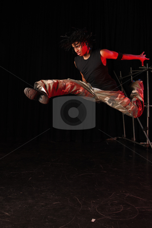 To use this stock image in your creative project, please select the size you need over to the right and click the "Add to Cart" button.
Your downloaded image will come with the Cutcaster watermark removed so don’t worry about the watermark you see on this page. Dancers on stage stock photo, Single African male dancer dancing on the stage with black background during training session. Lit with spotlights by Sean Nel