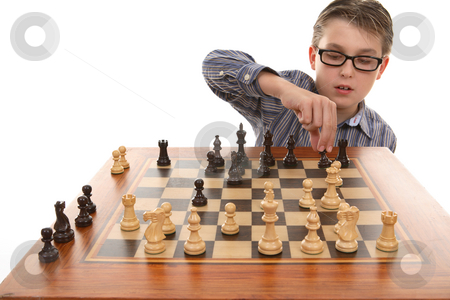 To use this stock image in your creative project, please select the size you need over to the right and click the "Add to Cart" button.
Your downloaded image will come with the Cutcaster watermark removed so don’t worry about the watermark you see on this page. Playing a game of chess stock photo, A boy moving a chess piece on a portable chess game table. by Leah-Anne Thompson