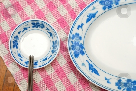 To use this stock image in your creative project, please select the size you need over to the right and click the "Add to Cart" button.
Your downloaded image will come with the Cutcaster watermark removed so don’t worry about the watermark you see on this page. Chinese style utensils stock photo, Dinng table set with Chinese style oriental utensils. For food and beverage, diet and nutrition concepts. by Wai Chung Tang