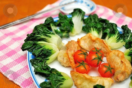 To use this stock image in your creative project, please select the size you need over to the right and click the "Add to Cart" button.
Your downloaded image will come with the Cutcaster watermark removed so don’t worry about the watermark you see on this page. Chinese dumplings and vegetables stock photo, Sumptuous looking Chinese style fried vegetarian dumplings and vegetables. Suitable for concepts such as diet and nutrition, healthy eating and healthy lifestyle, and food and beverage. by Wai Chung Tang