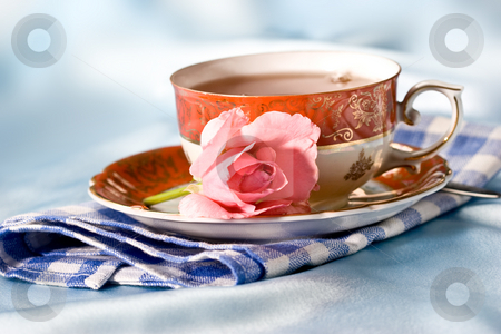 To use this stock image in your creative project, please select the size you need over to the right and click the "Add to Cart" button.
Your downloaded image will come with the Cutcaster watermark removed so don’t worry about the watermark you see on this page. romantic still life stock photo, Cup of tea with flower over azure by Gennady Kravetsky