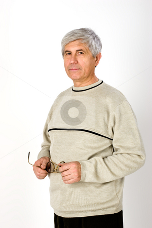 To use this stock image in your creative project, please select the size you need over to the right and click the "Add to Cart" button.
Your downloaded image will come with the Cutcaster watermark removed so don’t worry about the watermark you see on this page. Pensioner stock photo, People series: Portarit of aged man with glasses by Gennady Kravetsky