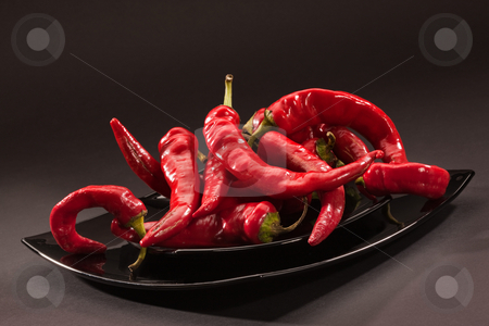 To use this stock image in your creative project, please select the size you need over to the right and click the "Add to Cart" button.
Your downloaded image will come with the Cutcaster watermark removed so don’t worry about the watermark you see on this page. Hot pepper stock photo, Food series: red hot pepper on black glassy plate by Gennady Kravetsky