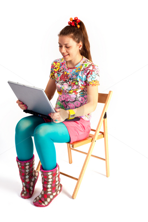 To use this stock image in your creative project, please select the size you need over to the right and click the "Add to Cart" button.
Your downloaded image will come with the Cutcaster watermark removed so don’t worry about the watermark you see on this page. Notebook girl stock photo, People series: young woman with notebook on chair by Gennady Kravetsky