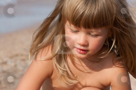 To use this stock image in your creative project, please select the size you need over to the right and click the "Add to Cart" button.
Your downloaded image will come with the Cutcaster watermark removed so don’t worry about the watermark you see on this page. Little girl stock photo, People series: summer portrait of little girl by Gennady Kravetsky
