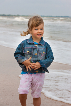 To use this stock image in your creative project, please select the size you need over to the right and click the "Add to Cart" button.
Your downloaded image will come with the Cutcaster watermark removed so don’t worry about the watermark you see on this page. Girl stock photo, People series: little girl on the beach by Gennady Kravetsky
