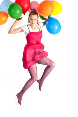 To use this stock image in your creative project, please select the size you need over to the right and click the "Add to Cart" button.
Your downloaded image will come with the Cutcaster watermark removed so don’t worry about the watermark you see on this page. Girl holiday stock photo, People series: young girl jumping with multicolored balloons by Gennady Kravetsky
