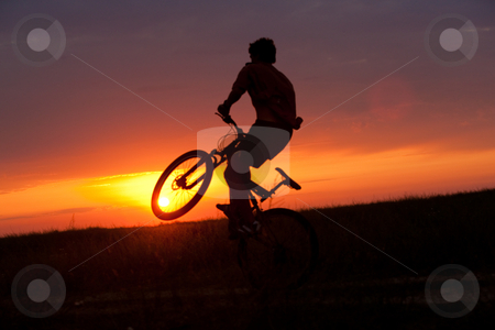 To use this stock image in your creative project, please select the size you need over to the right and click the "Add to Cart" button.
Your downloaded image will come with the Cutcaster watermark removed so don’t worry about the watermark you see on this page. Summer cyclist stock photo, People series: summer cyclist on the subset light by Gennady Kravetsky