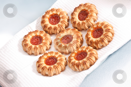 To use this stock image in your creative project, please select the size you need over to the right and click the "Add to Cart" button.
Your downloaded image will come with the Cutcaster watermark removed so don’t worry about the watermark you see on this page. Shortcake with jam stock photo, Food series: some sweet shortcakes on the serviette by Gennady Kravetsky