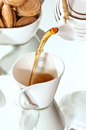 To use this stock image in your creative project, please select the size you need over to the right and click the "Add to Cart" button.
Your downloaded image will come with the Cutcaster watermark removed so don’t worry about the watermark you see on this page. Morning tea stock photo, Drink series: cup of tea with pastry by Gennady Kravetsky