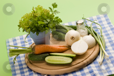 To use this stock image in your creative project, please select the size you need over to the right and click the "Add to Cart" button.
Your downloaded image will come with the Cutcaster watermark removed so don’t worry about the watermark you see on this page. Vegeterian food stock photo, Fresh vegetables: onion, carrot, cucumber and parsley by Gennady Kravetsky