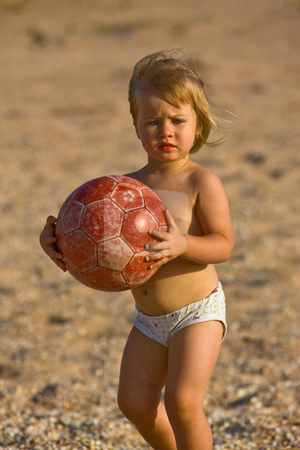 To use this stock image in your creative project, please select the size you need over to the right and click the "Add to Cart" button.
Your downloaded image will come with the Cutcaster watermark removed so don’t worry about the watermark you see on this page. Little child with ball stock photo, People series: little girl play on the beach with ball by Gennady Kravetsky