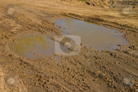 To use this stock image in your creative project, please select the size you need over to the right and click the "Add to Cart" button.
Your downloaded image will come with the Cutcaster watermark removed so don’t worry about the watermark you see on this page. Impassibility of roads stock photo, Ground series: puddle with heavy tires track by Gennady Kravetsky