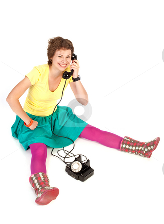 To use this stock image in your creative project, please select the size you need over to the right and click the "Add to Cart" button.
Your downloaded image will come with the Cutcaster watermark removed so don’t worry about the watermark you see on this page. Phone girl stock photo, People series: young girl in bright clothes speak on phone by Gennady Kravetsky