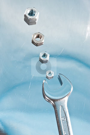 To use this stock image in your creative project, please select the size you need over to the right and click the "Add to Cart" button.
Your downloaded image will come with the Cutcaster watermark removed so don’t worry about the watermark you see on this page. Bolt and wrench stock photo, Tools series: hardware and wrench on reflectife metal surface by Gennady Kravetsky