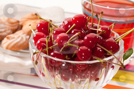 To use this stock image in your creative project, please select the size you need over to the right and click the "Add to Cart" button.
Your downloaded image will come with the Cutcaster watermark removed so don’t worry about the watermark you see on this page. Cherries stock photo, Food series: cherries in glassy bowl with pastry and compote by Gennady Kravetsky