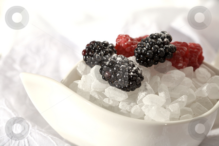 To use this stock image in your creative project, please select the size you need over to the right and click the "Add to Cart" button.
Your downloaded image will come with the Cutcaster watermark removed so don’t worry about the watermark you see on this page. Chipped sugar stock photo, Food series: chipped sugar with blackberry and raspberries by Gennady Kravetsky
