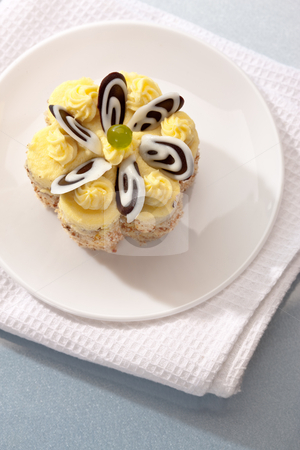To use this stock image in your creative project, please select the size you need over to the right and click the "Add to Cart" button.
Your downloaded image will come with the Cutcaster watermark removed so don’t worry about the watermark you see on this page. Fancy cake stock photo, Food series: sweet yellow cake with cream by Gennady Kravetsky
