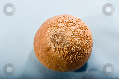 To use this stock image in your creative project, please select the size you need over to the right and click the "Add to Cart" button.
Your downloaded image will come with the Cutcaster watermark removed so don’t worry about the watermark you see on this page. Bun stock photo, Food series: tasty round bun with seed by Gennady Kravetsky
