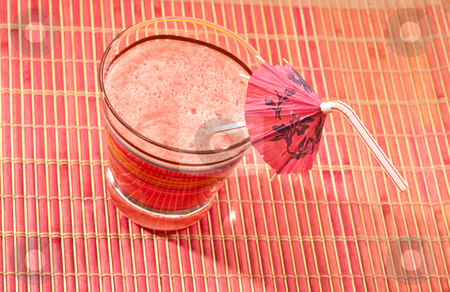 To use this stock image in your creative project, please select the size you need over to the right and click the "Add to Cart" button.
Your downloaded image will come with the Cutcaster watermark removed so don’t worry about the watermark you see on this page. Watermelon drink stock photo, Food series: watermelon drink with umbrella straw on pink napkin by Gennady Kravetsky