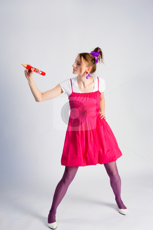 To use this stock image in your creative project, please select the size you need over to the right and click the "Add to Cart" button.
Your downloaded image will come with the Cutcaster watermark removed so don’t worry about the watermark you see on this page. Girl make note stock photo, People series: funny girl with pencil over gray by Gennady Kravetsky