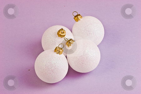 To use this stock image in your creative project, please select the size you need over to the right and click the "Add to Cart" button.
Your downloaded image will come with the Cutcaster watermark removed so don’t worry about the watermark you see on this page. Christmas balls stock photo, Four white balls on the violet background by Gennady Kravetsky