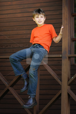 To use this stock image in your creative project, please select the size you need over to the right and click the "Add to Cart" button.
Your downloaded image will come with the Cutcaster watermark removed so don’t worry about the watermark you see on this page. Boy sitting on the verandah stock photo, A child sits on the timber balustrade of a verandah - 400 iso by Leah-Anne Thompson