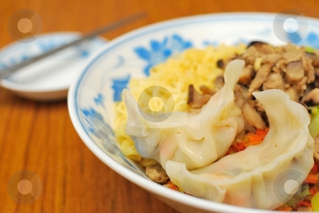 To use this stock image in your creative project, please select the size you need over to the right and click the "Add to Cart" button.
Your downloaded image will come with the Cutcaster watermark removed so don’t worry about the watermark you see on this page. Chinese style vegetarian noodles stock photo, Sumptuous looking Chinese style vegetarian noodles with mock meat and dumpling. Suitable for concepts such as diet and nutrition, healthy eating and healthy lifestyle, and food and beverage. by Wai Chung Tang