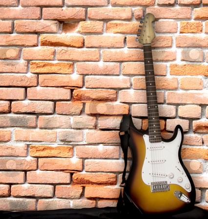 To use this stock image in your creative project, please select the size you need over to the right and click the "Add to Cart" button.
Your downloaded image will come with the Cutcaster watermark removed so don’t worry about the watermark you see on this page. Guitar leaning on a wall stock photo, Electric guitar leaning over a brick wall by Fabio Alcini