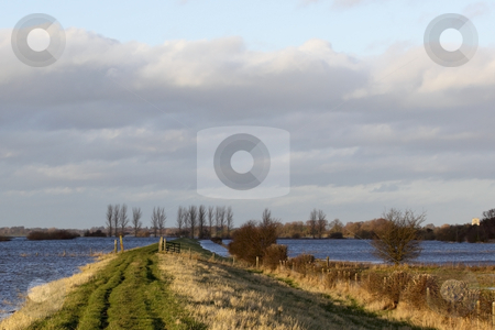 To use this stock image in your creative project, please select the size you need over to the right and click the "Add to Cart" button.
Your downloaded image will come with the Cutcaster watermark removed so don’t worry about the watermark you see on this page. Winter floods 6 stock photo, A view along the defensive banks of the river derwent in yorkshire during the winter floods by Mike Smith